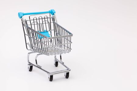 Shopping trolley on the white backgroundの写真素材