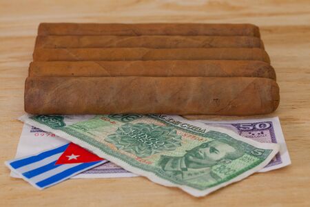Luxury Cuban cigars and money on the wooden tableの写真素材