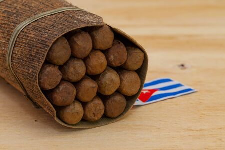 Luxury Cuban cigars on the wooden tableの写真素材