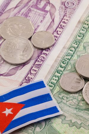 Different cuban banknotes and coins on the table.の写真素材