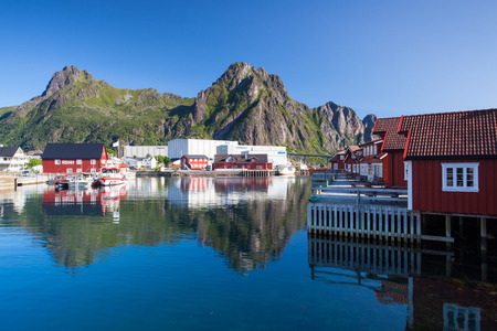 Henningsvaer, Norway - August 19,2017: Picturesque fishing port in Henningsvaer on Lofoten islands, Norway with typical red wooden buildings and small fishing boatsのeditorial素材