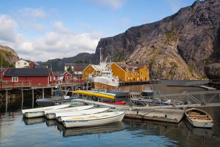 Nusfjord, Norway - August 21,2017: Red Classic Norwegian Rorbu fishing huts, Nusfjord on Lofoten islands. Norwegian traditional type of house used by fishermenのeditorial素材