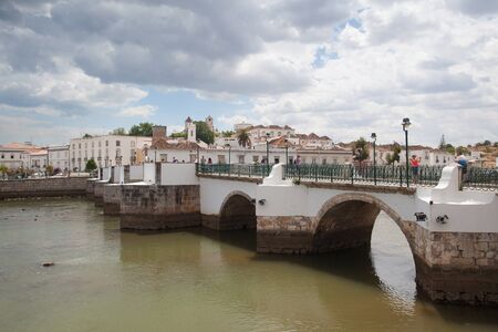 Tavira, Portugal - July 2, 2014: View of Tavira via the Gilao River on the southern Portuguese coast of the Atlantic. Tavira is an ancient Moorish town that has retained its unique character and heritage to become one of the finest resort towns of the Algのeditorial素材