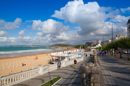 Santander,Spain - July 1, 2017: El Sardinero waterfront promenade and surfer beach. El Sardinero is a popular beach located in the Spanish city of Santander, Cantabriaのeditorial素材