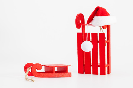 Santa Claus Red Wodden Sleigh with Santa Cap isolated on white background