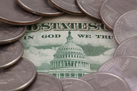 The quarters of USA and us banknote. A circle of the US quarters with George Washington and in the middle us banknoteの写真素材