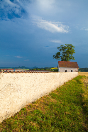 Cemetery between the fields at the village Merunice. Merunice is a village and municipality in Teplice District, Czech Bohemian Highlands, Czech Republic.の写真素材