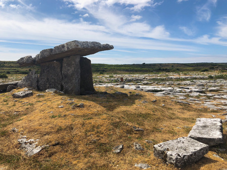 The Poulnabrone Dolmen is located near the townland of Caherconnell in co. Clare, Ireland. A dolmen is a type of single-chamber megalithic tombの写真素材