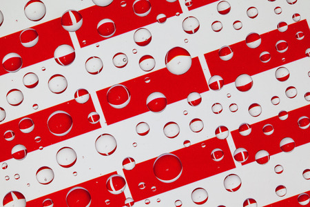 Flags  of Indonesia, behind a glass covered with rain drops.Pattern from flags on Indonesia. 3D...
