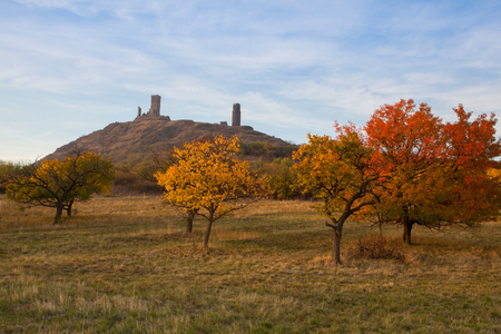 Famous Hazmburk Castle at sunset.Central Bohemian Uplands,Czech Republic. At the top of the mountain there is the ruin of a mediaeval castle, of which two towers and some wall fragments are still standing.のeditorial素材