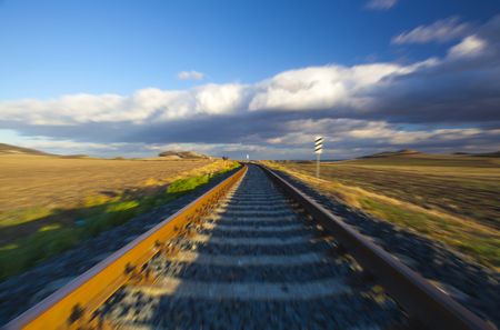 Single railway track at sunset, Central Bohemian Uplands, Czech Republic. Railway track in nature park Central Bohemian Highlands, Czech Republicの写真素材