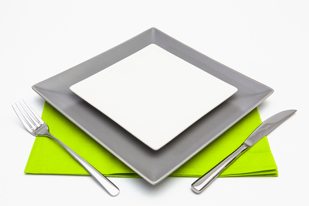 White and gray square plates on the white wooden table.Top view.Flat Lay Image.の写真素材