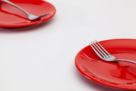 Red plates on the white wooden table.Top view. Flat Lay Image.の写真素材