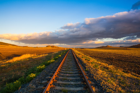 Single railway track at sunset, Central Bohemian Uplands, Czech Republic. Railway track in nature park Central Bohemian Highlands, Czech Republicの写真素材