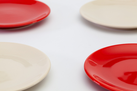 Red plates on the white wooden table.Top view. Flat Lay Image.の写真素材