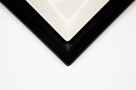 Different  black and white plates on the white table.Top view. Flat Lay Image.の写真素材