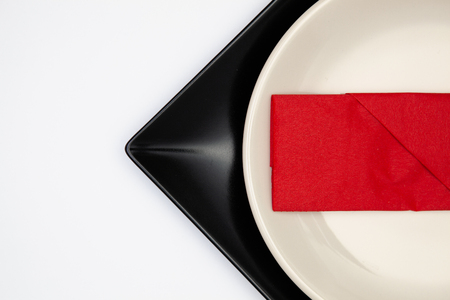 Different  black and white plates on the white table.Top view. Flat Lay Image.の写真素材