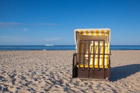 Typical beach chair on the beach in Ahlbeck. Ahlbeck is a district of the Heringsdorf municipality on the island of Usedom on the Baltic coast.の写真素材