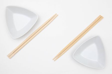Top View Of White Empty Sushi Plates With Bamboo Chopsticks. Symmetry Food Design