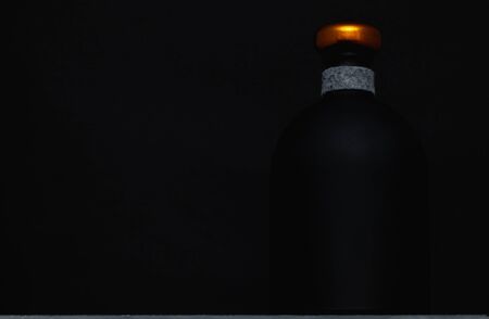 Empty Luxury Black Glass Whiskey, Vodka, Gin, Rum, Ticture or Tequila Bottle.の写真素材