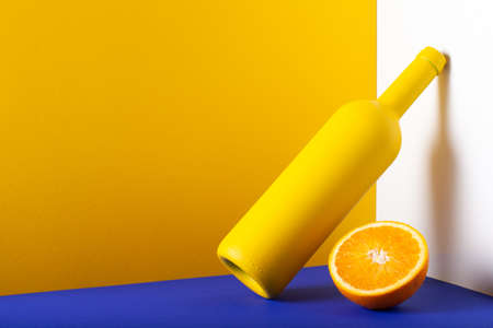 Big round of hard cheese with knife on the slate desk in the dark background.の写真素材