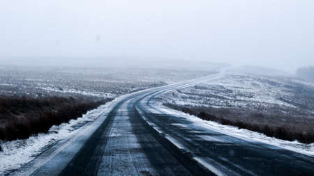 A long mysterious road, with many cold dark colours to question where will you end up at the end of it?の写真素材