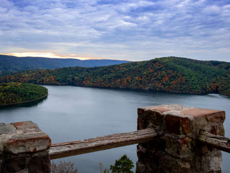 Gorgeous view of Raystown Lake from Hawnâs Overlook near Altoona, Pennsylvania in the fall right before sunset with a view of the dramatic blue sky filled with clouds and pops of pink with foliage.の写真素材