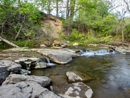 Spring landscape nature scene in Mingo Creek County Park in Washington County in Southwestern Pennsylvania with a creek flowing through the scenic park.の写真素材