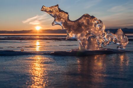 Dragon of ice meets dawn at winter Lake Baikalの写真素材