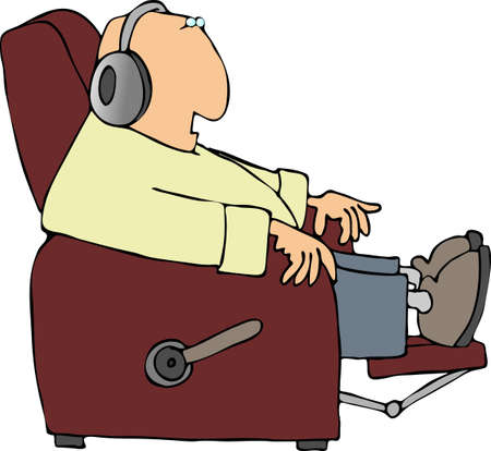 Man listening to headphones while sitting in a reclinerの写真素材