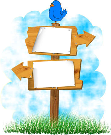 Wooden signs with a bird on topの写真素材