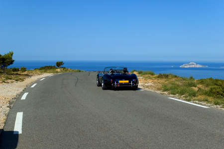 luxury car and road with view on the seaの写真素材