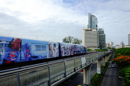 Ratchadamri, Bangkok, Thailand : June 24, 2016 : The Bangkok Mass Transit System (BTS) on the tracking go out from Ratchadamri station to Silom station while another train coming. BTS is the most convenient transportation in Bnagkok.のeditorial素材