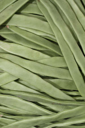 green beans heaped at the marketの写真素材