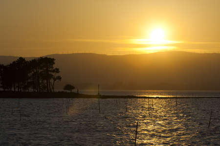 holiday at sea, sunset on the islandの写真素材