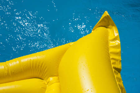 yellow mat in the pool, summer and holidaysの写真素材