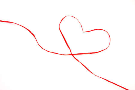 gift ribbon drawing a heartの写真素材