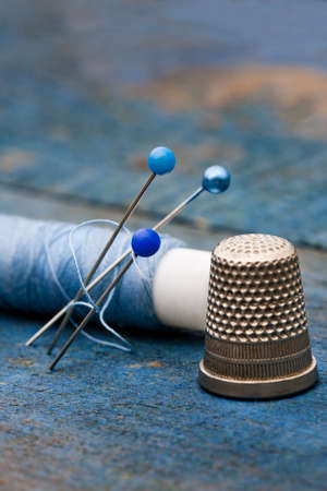 thread, needles and thimble