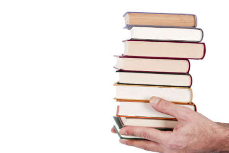 hands holding stacked books on white backgroundの写真素材