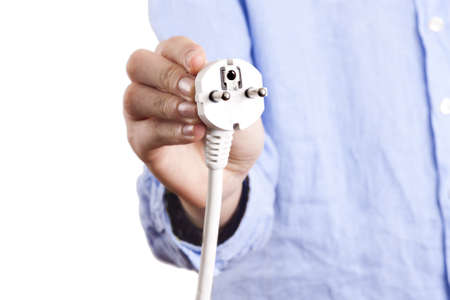 businessman holding the power cord with plugの写真素材
