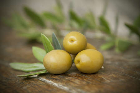 olives and olive leavesの写真素材