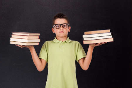 boy with books in their handsの写真素材