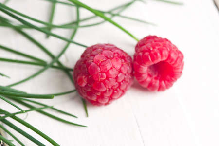 natural raspberries on white background
