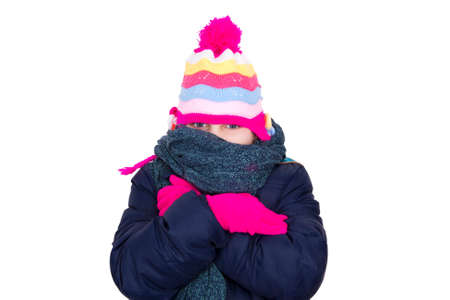 child warm in winter clothes on white background の写真素材