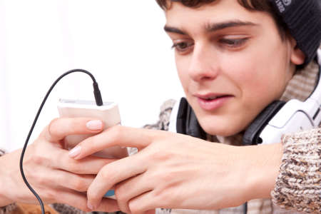 Teen chatting with mobile phoneの写真素材