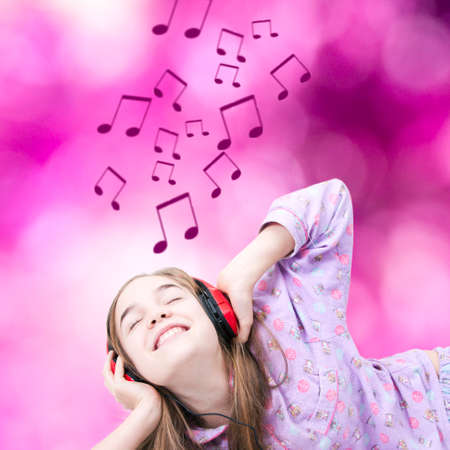 Young smiling listening to music with headphonesの写真素材