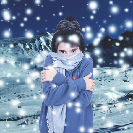 warm winter clothing boy snowing in the mountainsの写真素材