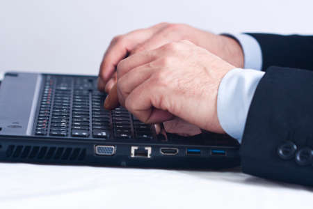 Businessman working in office with computerの写真素材