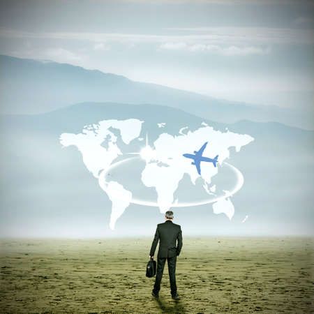 businessman on the esplanade of the desert with world mapの写真素材