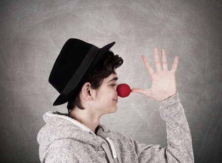 closeup portrait of young teenage girl with clown costumeの写真素材